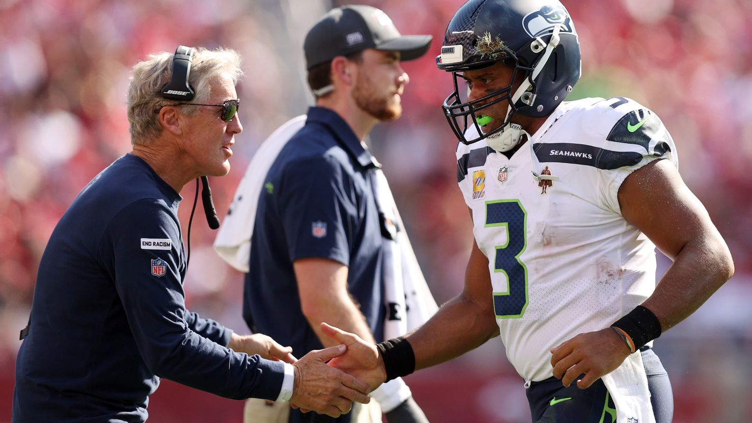 Russell Wilson celebrates with head coach Pete Carroll after a touchdown during the third quarter against the San Francisco 49ers at Levi's Stadium.