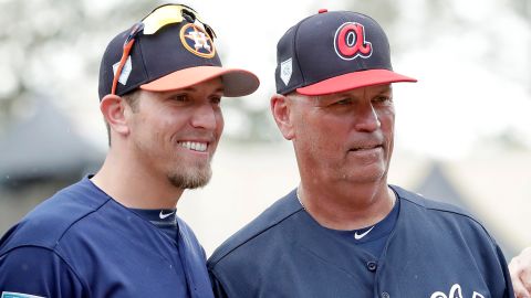 Houston Astros hitting coach Troy Snitker (left) stands with his father, Braves manager Brian Snitker, during an exhibition game in 2019.