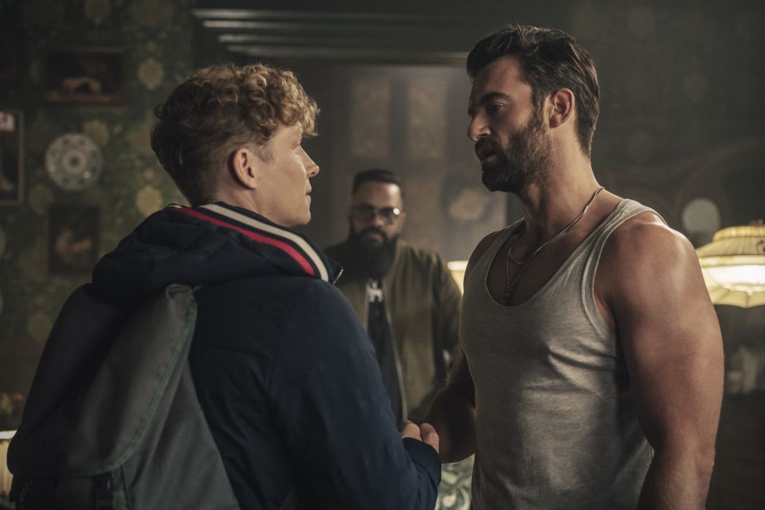 Matthias Schweighöfer (left) plays a genius safecracker in  "Army of Thieves." He's shown with Stuart Martin (right) and Guz Khan (background).