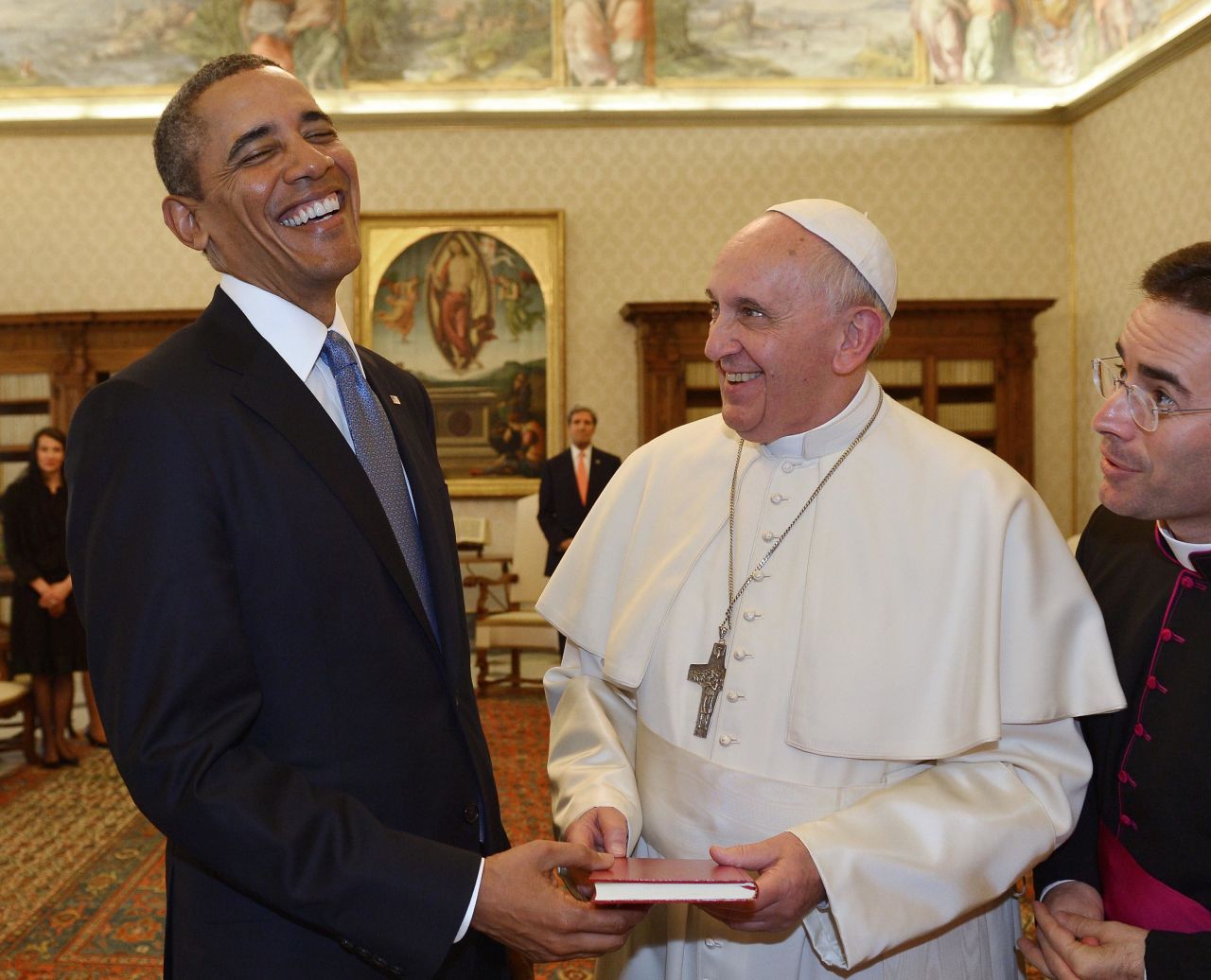 Pope Francis and President Barack Obama exchange gifts during a private audience at the Vatican in 2014.