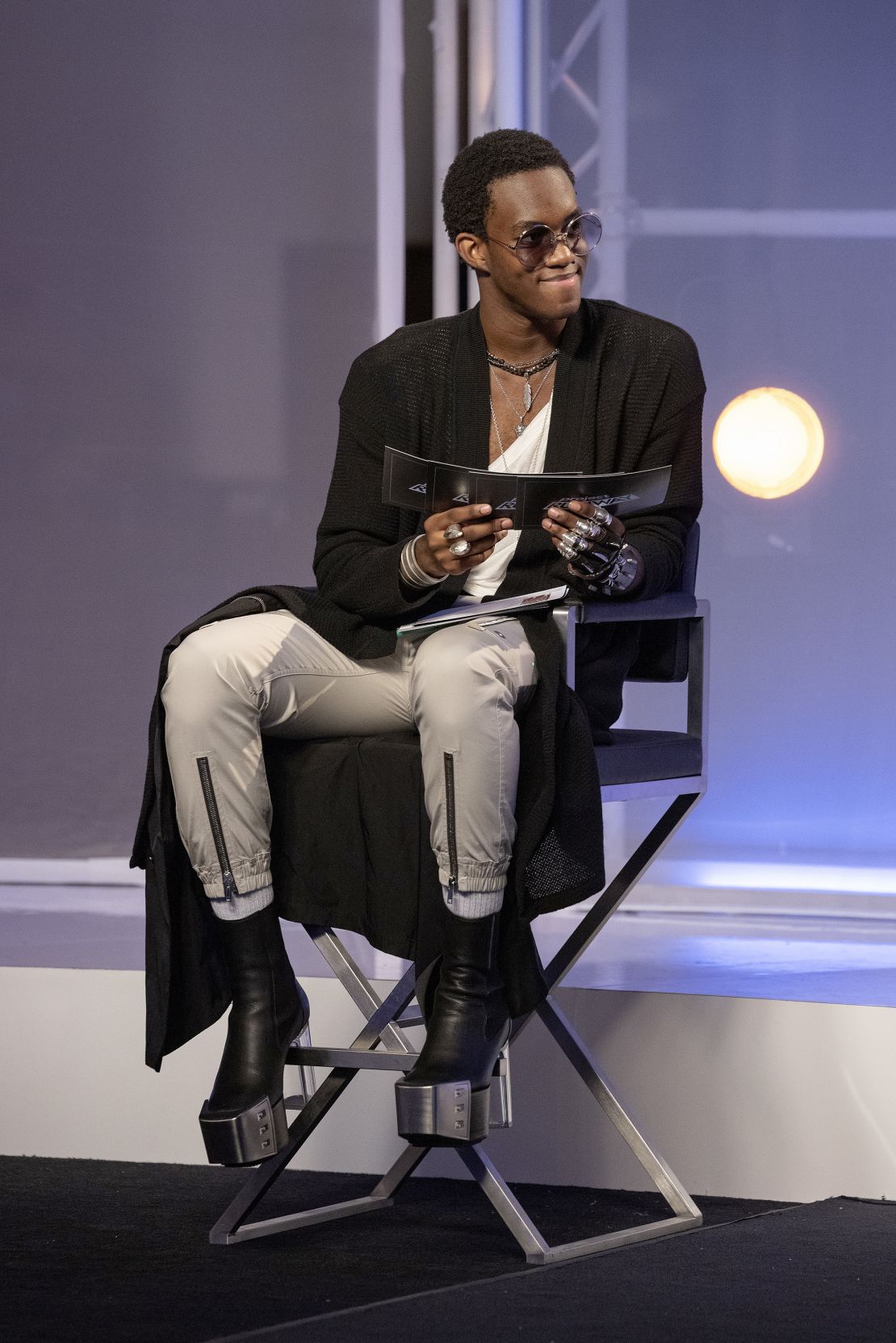 Model and TikTok star Wisdom Kaye wearing platform boots on an episode of "Project Runway."