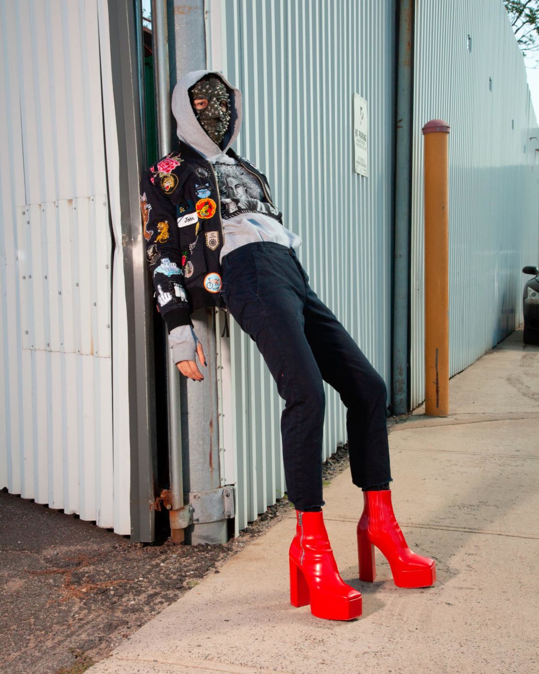 A model wearing a pair of red Syro platform boots, which sold out "almost immediately" according to co-founder Shaobo Han.