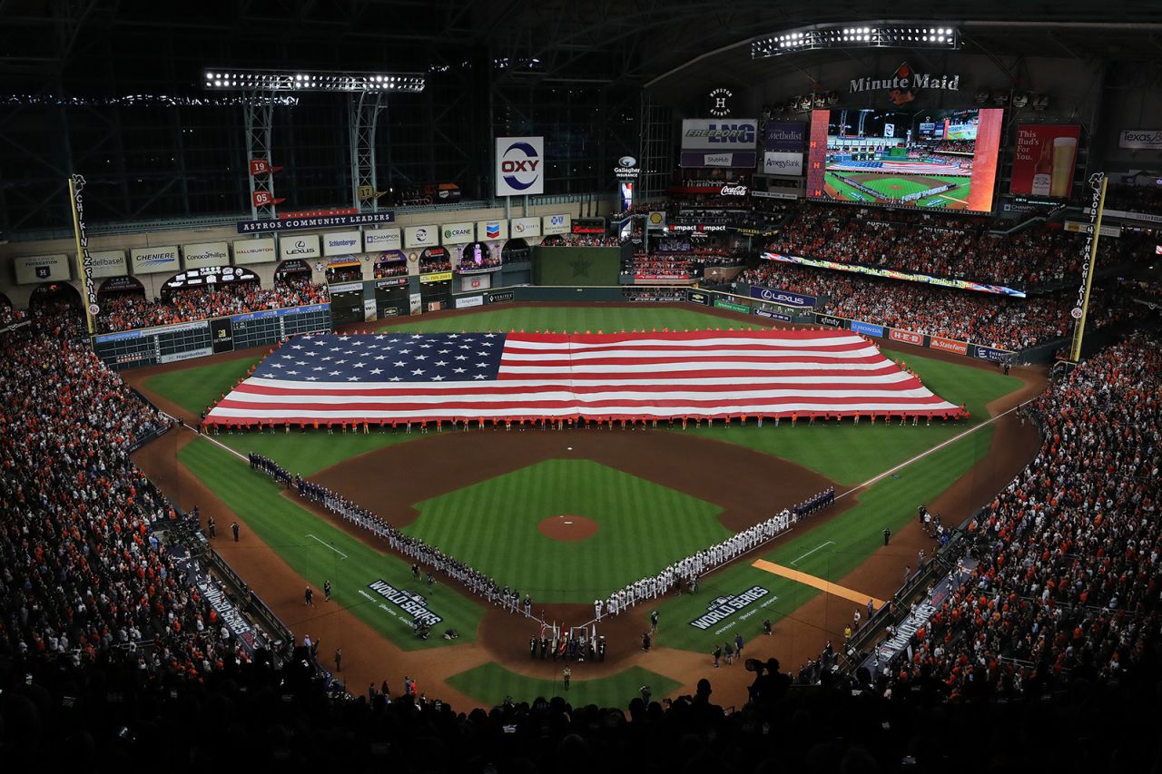 The Astros and the Braves line up for the national anthem prior to the first pitch of Game 1 in Houston. 