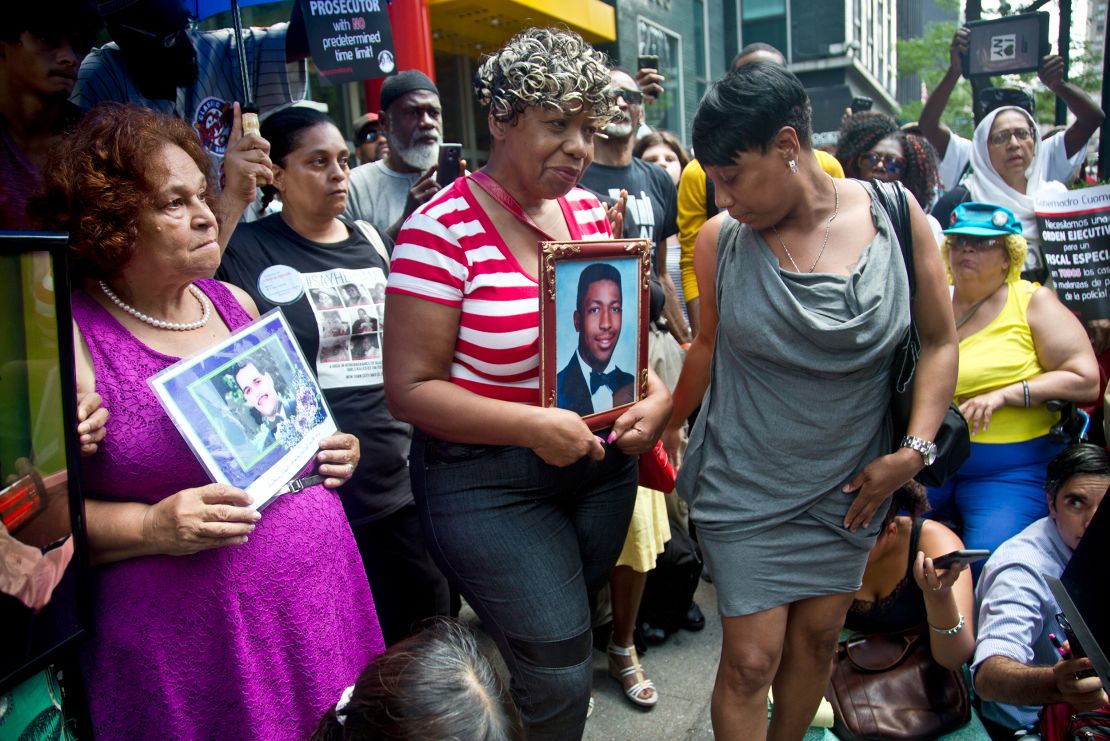 Gwen Carr, center, and other family members of people who died in police custody prepare to speak during a news conference outside then- New York Gov. Andrew Cuomo's office in July 2015