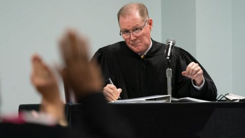 Judge Timothy Walmsley administers the oath to potential jurors at the Glynn County Superior Court in Brunswick, Georgia. 