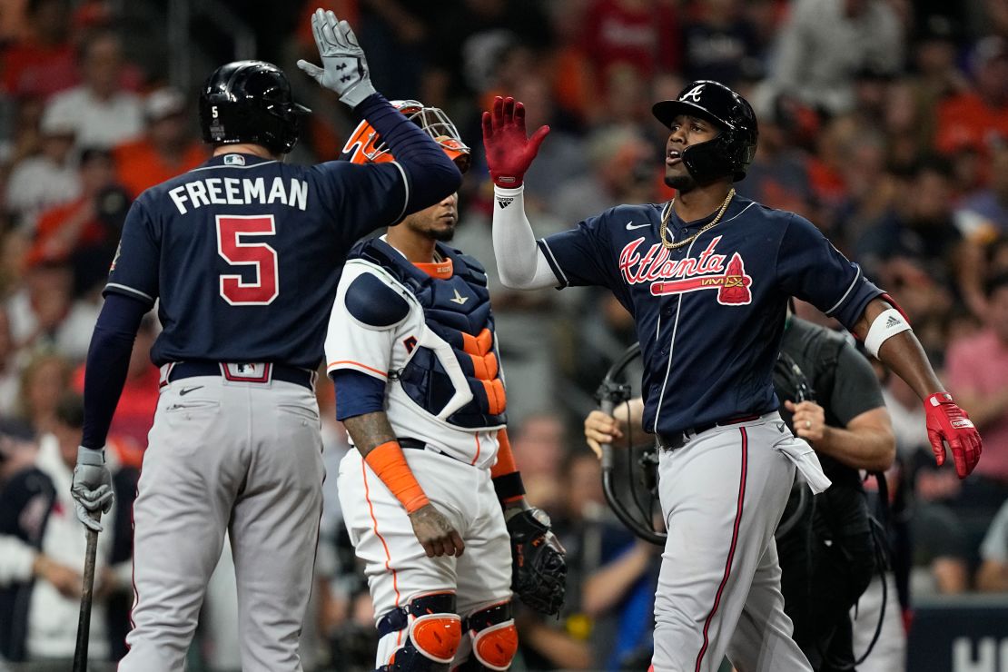 Soler celebrates his home run with Freddie Freeman during the first inning of Game 1 of the World Series between the Astros and the Braves.