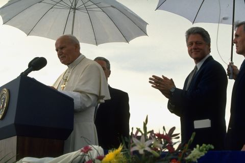 President Bill Clinton stands by as Pope John Paul II speaks at a news conference in Denver in 1993.