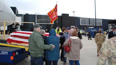 Family surround Harold Hayden's casket as after it arrives in Maryland.