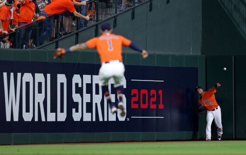 Michael Brantley of the Astros catches a fly ball against the Braves during the eighth inning of Game 2.