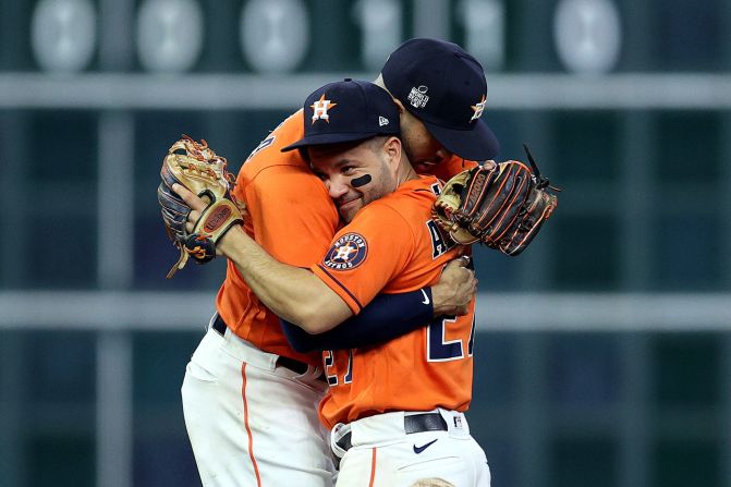 Carlos Correa and Jose Altuve of the Astros celebrate <a href="index.php?page=&url=https%3A%2F%2Fwww.cnn.com%2F2021%2F10%2F28%2Fsport%2Fhouston-astros-game-2-world-series-spt-intl%2Findex.html" target="_blank">the team's 7-2 win</a> against the Braves in Game 2 of the World Series on Wednesday, October 27, in Houston.