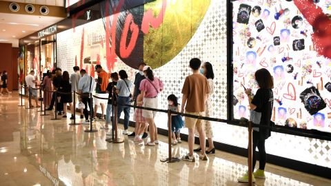 Shoppers lining up to enter a Louis Vuitton store in Nanjing, in east China's Jiangsu province, in August.