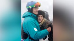 Australia's Alex Pullin, left, hugs his girlfriend Ellidy Vlug during prior to a men's snowboard cross competition at the Rosa Khutor Extreme Park, at the 2014 Winter Olympics, Monday, Feb. 17, 2014, in Krasnaya Polyana, Russia. (AP Photo/Andy Wong)