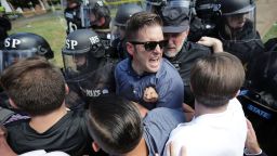 White nationalist Richard Spencer (center) and his supporters clash with Virginia State Police in Emancipation Park after the "Unite the Right" rally was declared an unlawful gathering August 12, 2017 in Charlottesville, Virginia. 