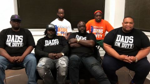 Six members of Dads on Duty, who started taking shifts in the halls of Southwood High School to calm students, spread positivity and keep the peace.