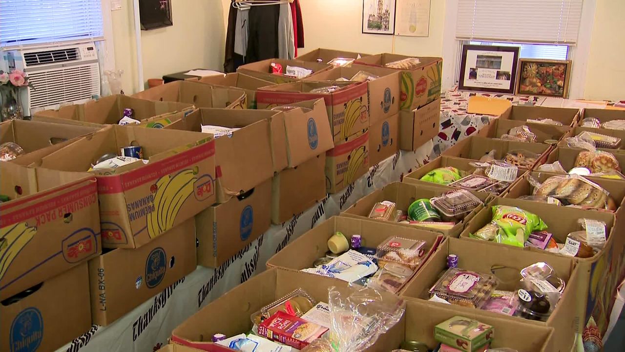 The Mission House in Philadelphia prepares food boxes for families in need.