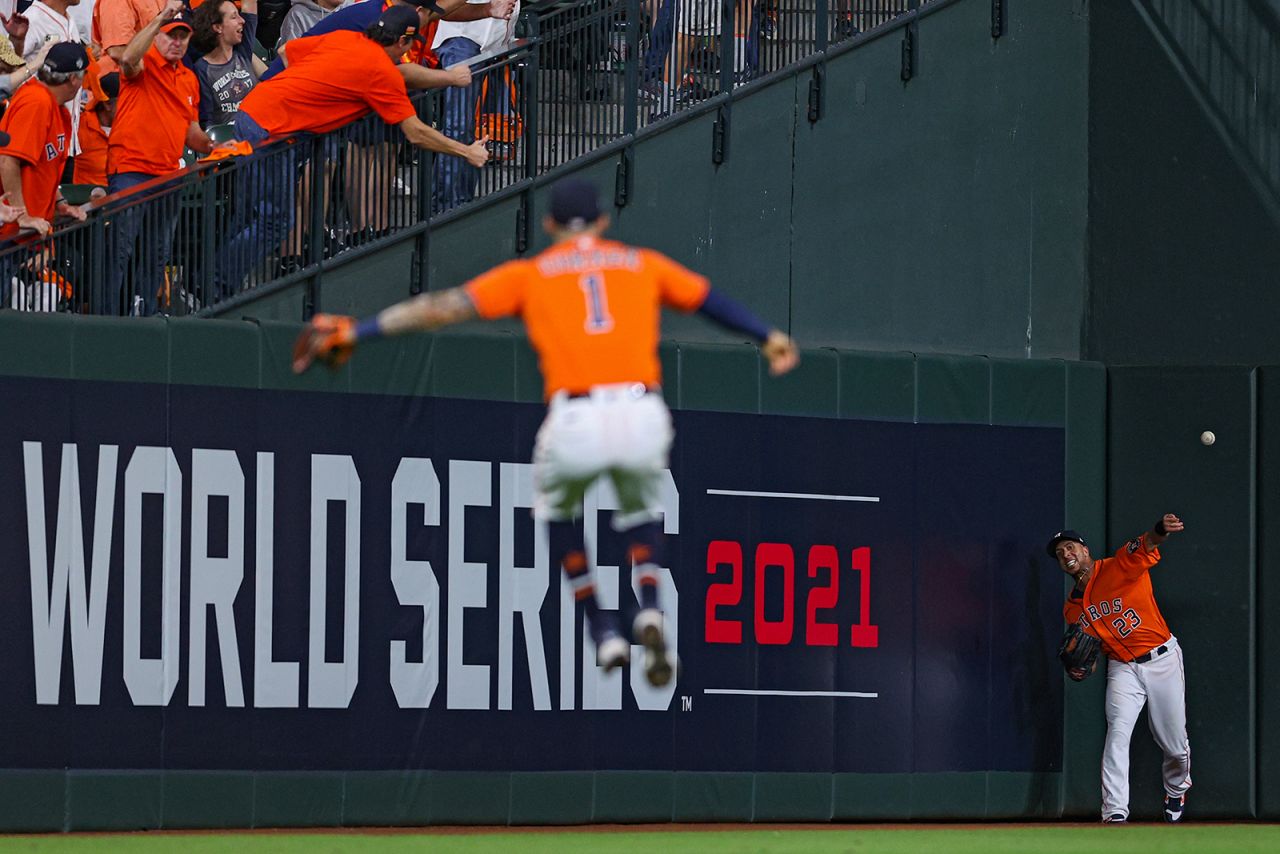 Houston outfielder Michael Brantley makes a throw after catching a ball in Game 2 of the <a href="http://www.cnn.com/2021/10/26/sport/gallery/world-series-2021/index.html" target="_blank">World Series</a> on Wednesday, October 27. Houston is facing Atlanta in this year's Fall Classic.