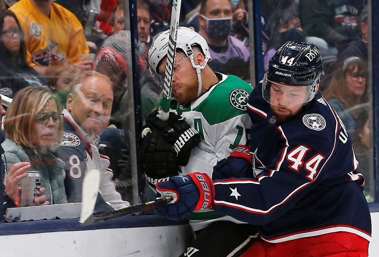 Columbus defenseman Vladislav Gavrikov checks Dallas' Joe Pavelski against the boards during an NHL game in Columbus, Ohio, on Monday, October 25.