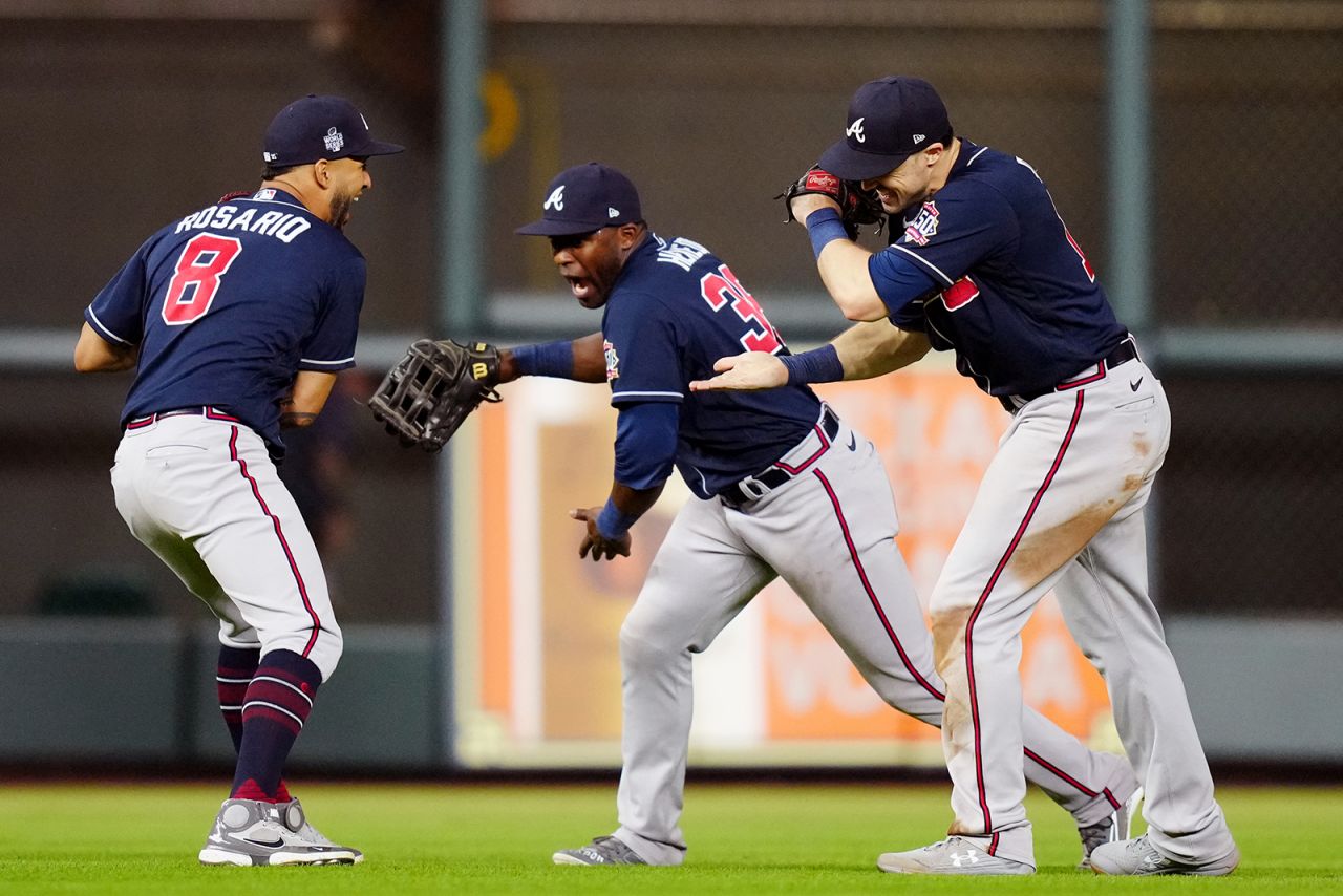From left, Atlanta's Eddie Rosario, Guillermo Heredia and Adam Duvall celebrate after the Braves defeated Houston in Game 1 of the <a href="http://www.cnn.com/2021/10/26/sport/gallery/world-series-2021/index.html" target="_blank">World Series</a> on Tuesday, October 26.