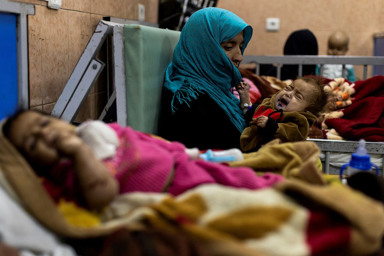 Farzana holds her 1-year-old son, Omar, inside the malnutrition ward at a hospital in Kabul, Afghanistan, on Saturday, October 23.