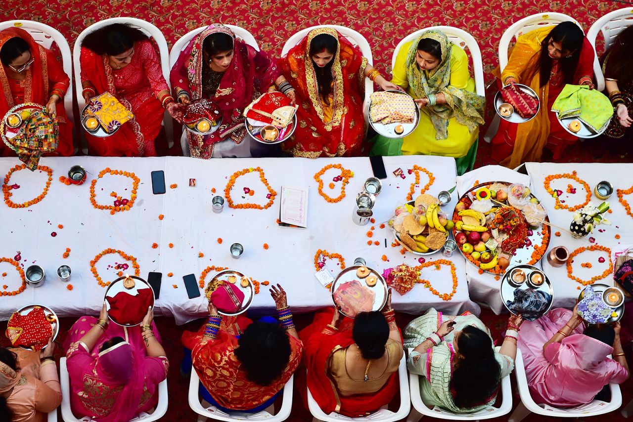Women in Prayagraj, India, offer prayers as they celebrate the Hindu festival of Karva Chauth on Sunday, October 24. During the festival, married women fast the whole day and offer prayers to the moon for the welfare, prosperity and longevity of their husbands.