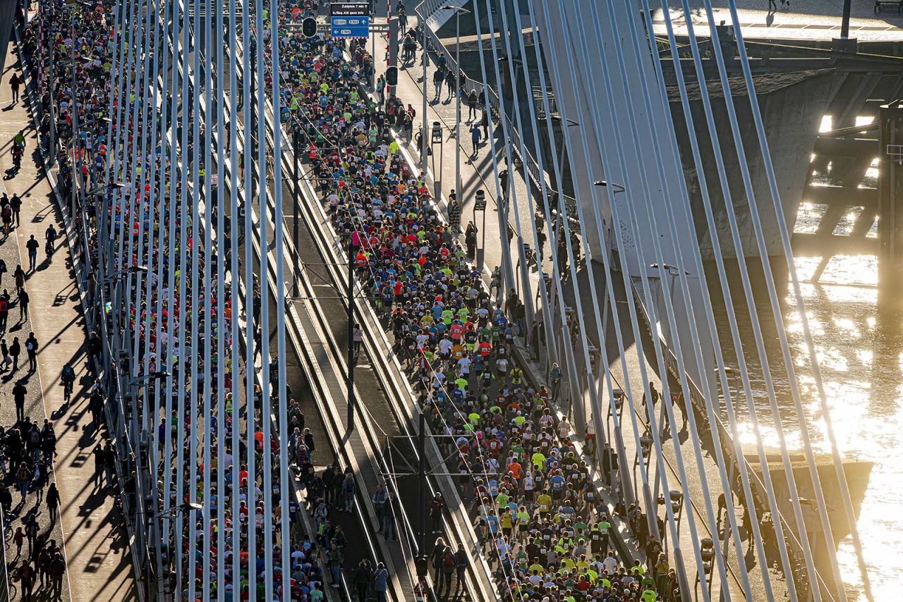 People cross the Erasmus Bridge as they run the Rotterdam Marathon in the Netherlands on Sunday, October 24.