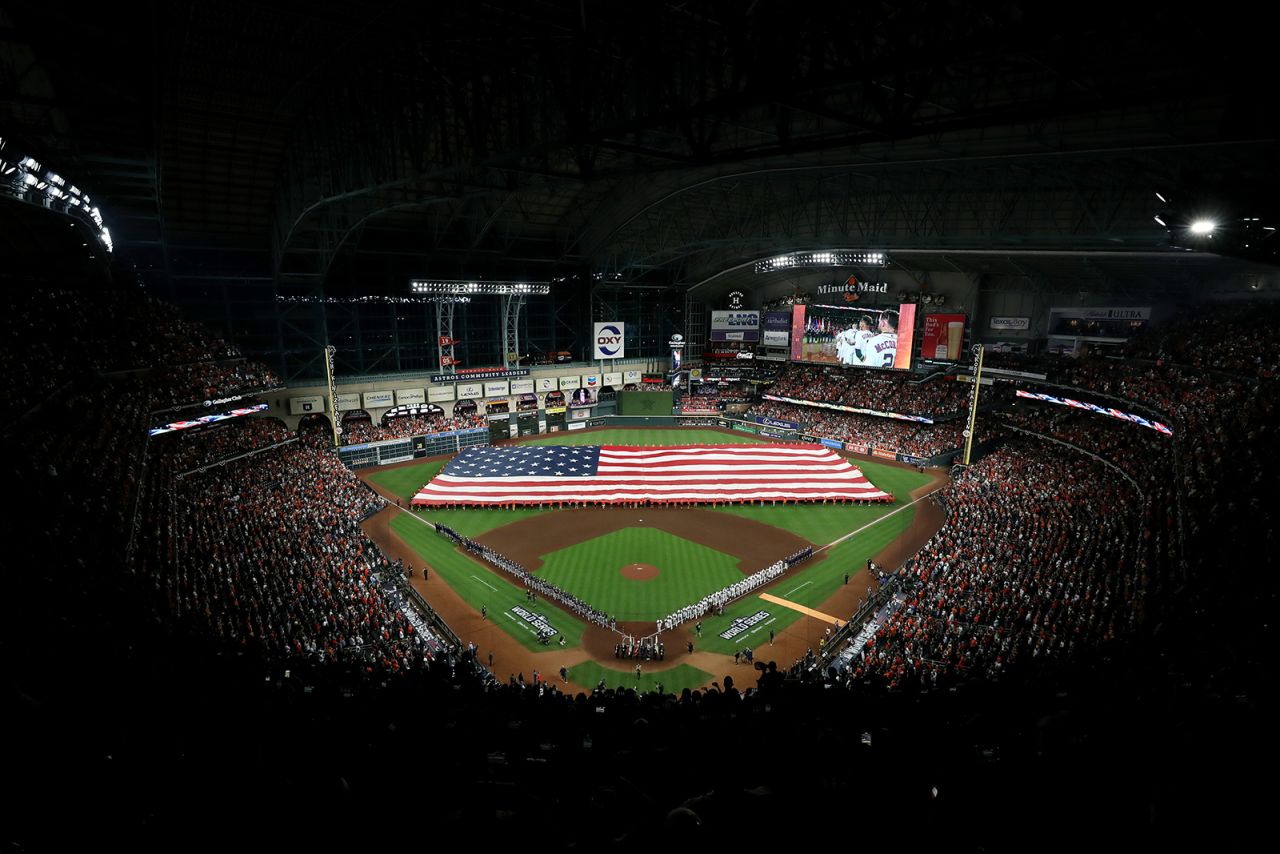 The American flag covers the outfield at Houston's Minute Maid Park before the first game of the <a href="http://www.cnn.com/2021/10/26/sport/gallery/world-series-2021/index.html" target="_blank">World Series</a> on Tuesday, October 26.