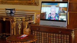 LONDON, ENGLAND - OCTOBER 28: Queen Elizabeth II appears on a screen via videolink from Windsor Castle, where she is in residence, during a virtual audience to receive David Constantine and present him with The Queen's Gold Medal for Poetry, at Buckingham Palace, on October 28, 2021 in London, England.  (Photo by Kirsty O'Connor - Pool/Getty Images)
