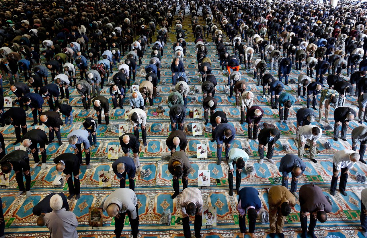 People gather inside a mosque in Tehran, Iran, on Friday, October 22. They were performing Friday prayers for the first time since authorities eased Covid-19 restrictions.