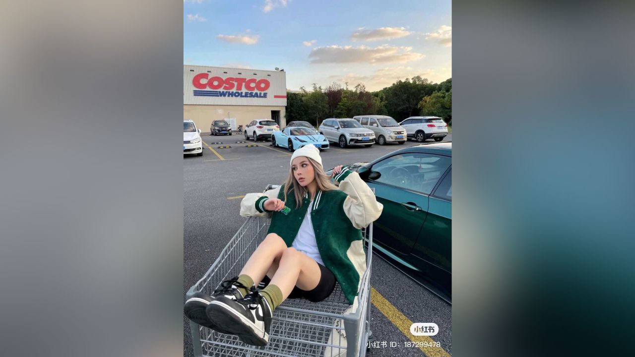 A Chinese influencer poses in the Costco parking lot in Shanghai.