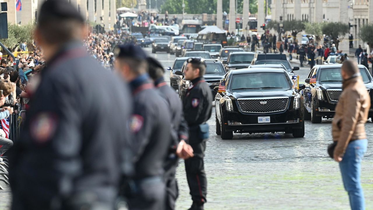Police officers stand by as the motorcade of President Joe Biden arrives across the Via della Conciliazione in Rome leading to the Vatican on Friday, October 29, 2021.