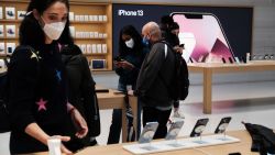 NEW YORK, NEW YORK - SEPTEMBER 24: People shop at the Fifth Avenue Apple Store during the launch of Apple's new iPhone 13 and iPhone 13 Mini on September 24, 2021 in New York City. The new phones come equipped with a A15 Bionic chip, improved dual-camera system and longer battery life than the iPhone 12. The iPhone 13 Mini starts at $729, and the iPhone 13 starts at $829. (Photo by Spencer Platt/Getty Images)