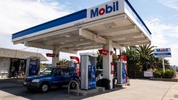 Vehicles at fuel pumps at Exxon Mobil gas station in San Pablo, California, U.S., on Tuesday, July 27, 2021. Pinterest Inc. is expected to release earnings figures on July 29. 