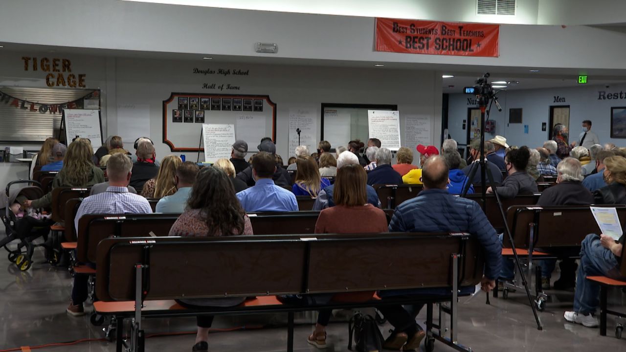 The crowd at the busy town hall applauded speakers who spoke out against CRT teaching.