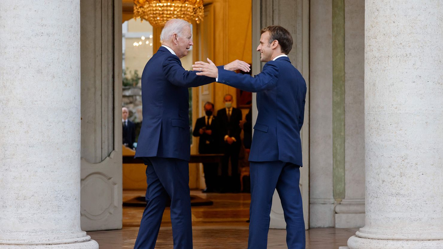 TOPSHOT - French President Emmanuel Macron (R) welcomes US President Joe Biden before their meeting at the French Embassy to the Vatican in Rome on October 29, 2021. (Photo by Ludovic MARIN / AFP) (Photo by LUDOVIC MARIN/AFP via Getty Images)