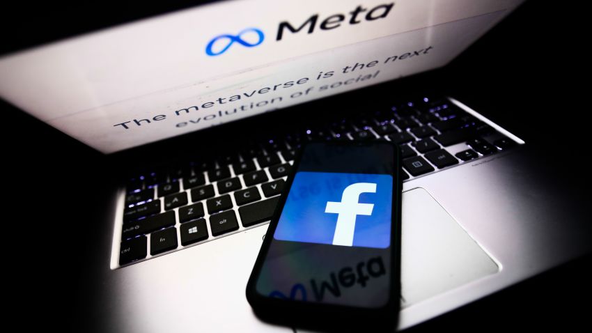 Meta website displayed on a laptop screen and Facebook app logo displayed on a phone screen are seen in this illustration photo taken in Krakow, Poland on October 28, 2021. Mark Zuckerberg announced during Facebook Connect event that the new name of Facebook company will be Meta. (Photo by Jakub Porzycki/NurPhoto via Getty Images)