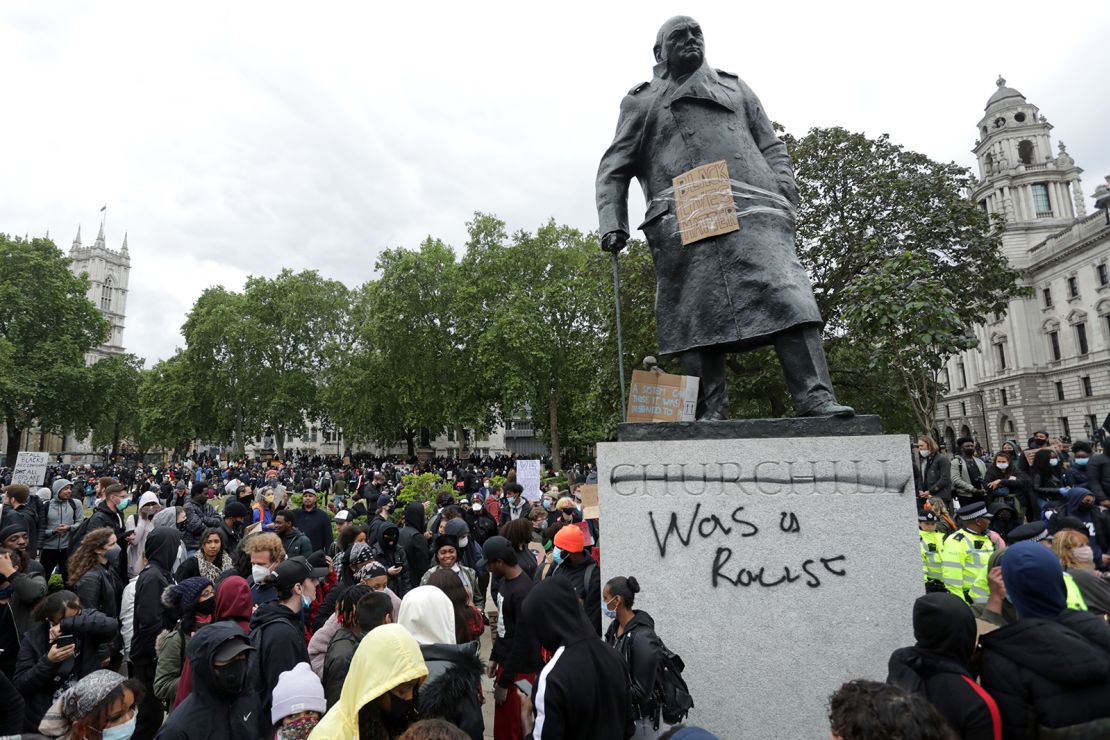 The statue of former British prime minister Winston Churchill is seen defaced, with the words (Churchill) "was a racist" in Parliament Square, central London after a demonstration on June 7, 2020. 