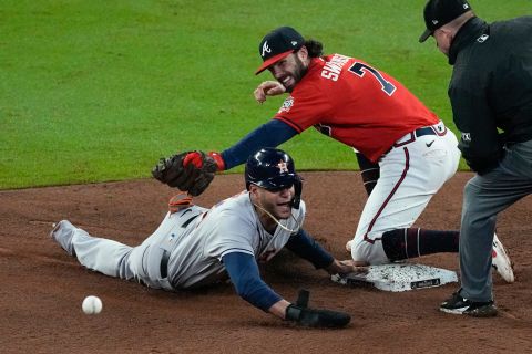 The Astros' Jose Siri is safe at second after the Braves shortstop Dansby Swanson missed the throw during the eighth inning.