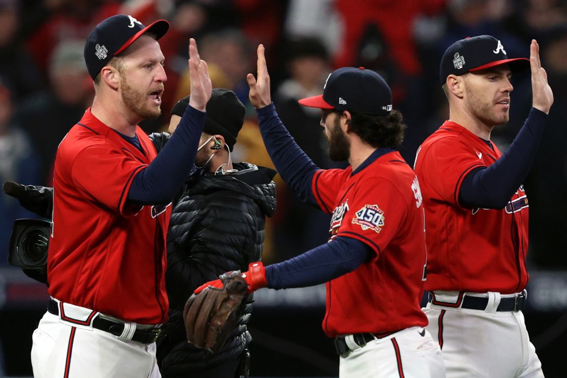 Will Smith of the Atlanta Braves celebrates with Dansby Swanson after closing out the 2-0 win against the Houston Astros in Game Three of the World Series.