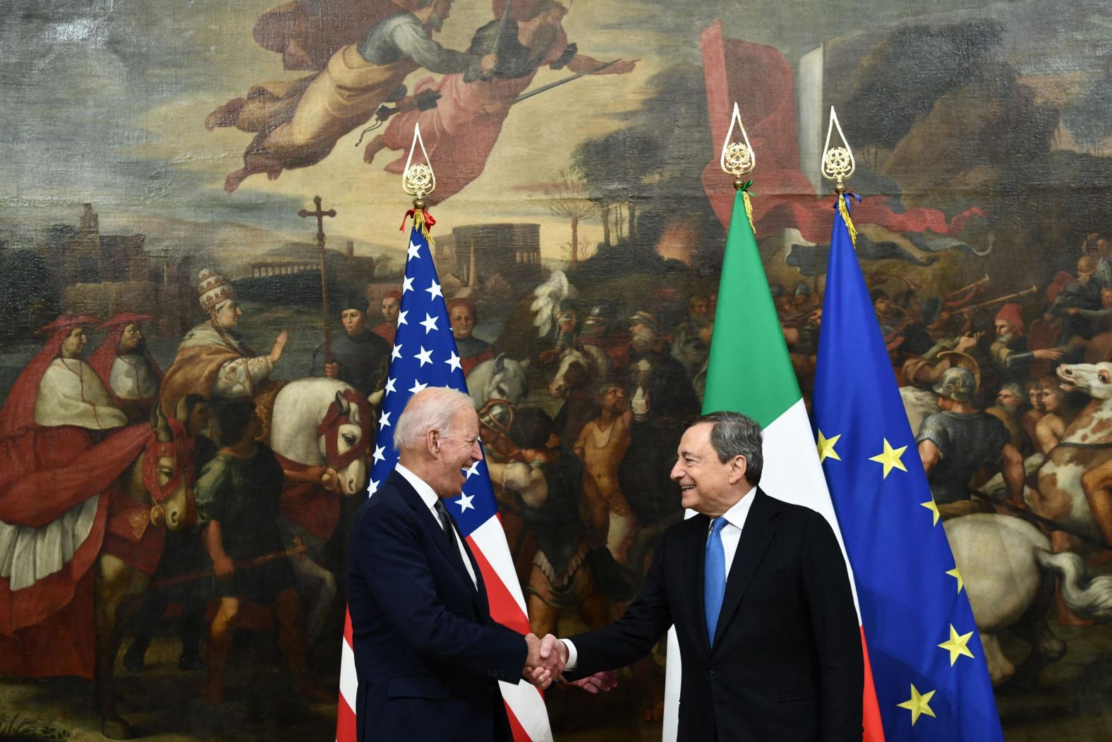 Biden shakes hands with Italian Prime Minister Mario Draghi during <a href="index.php?page=&url=https%3A%2F%2Fwww.cnn.com%2F2021%2F10%2F29%2Fpolitics%2Fmario-draghi-sergio-mattarella-biden-meeting%2Findex.html" target="_blank">their meeting</a> at the Chigi Palace in Rome on Friday. He also had a bilateral meeting with Italian President Sergio Mattarella at the Quirinale Palace.