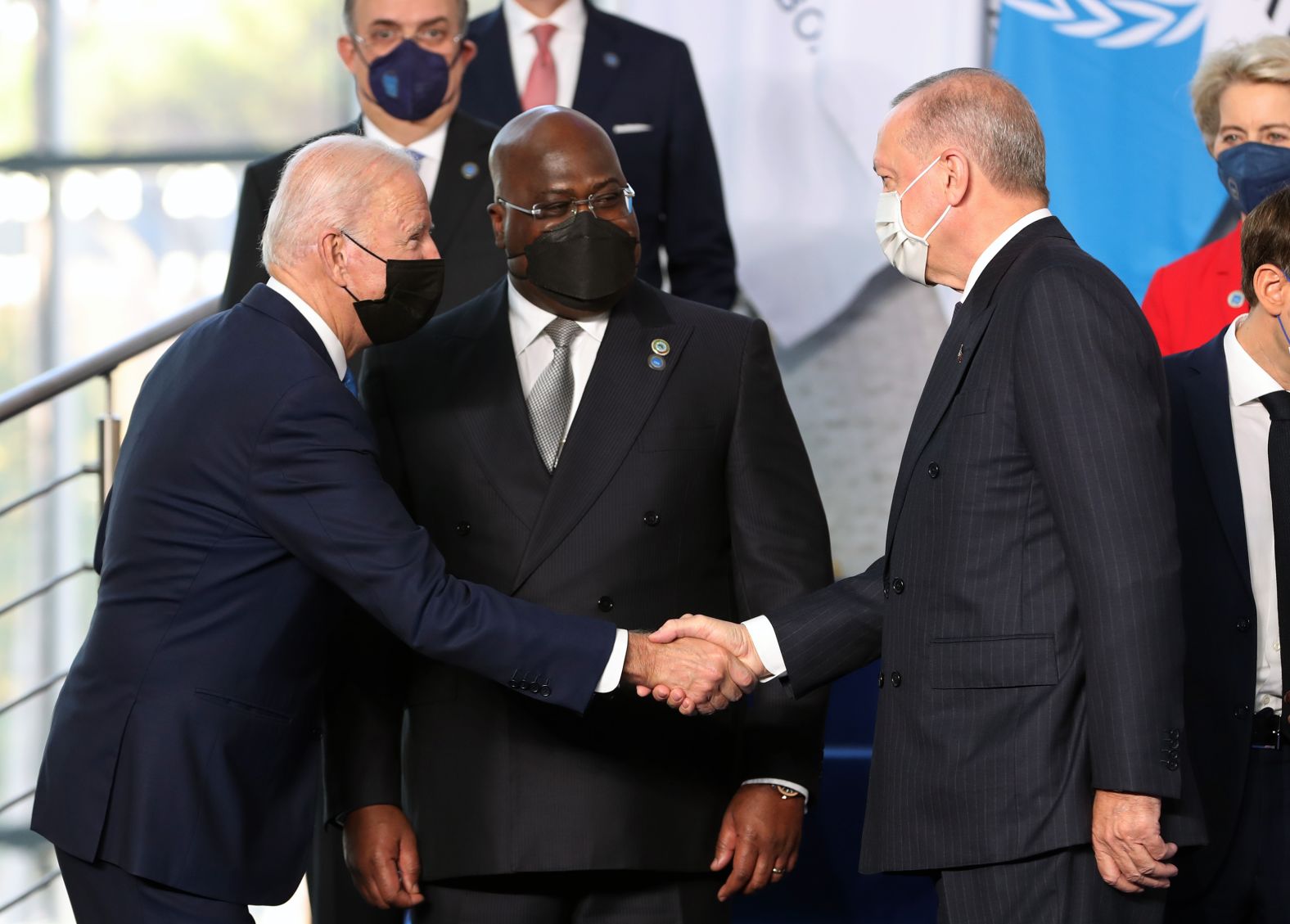 Biden shakes hands with Erdogan at the group photo shoot.