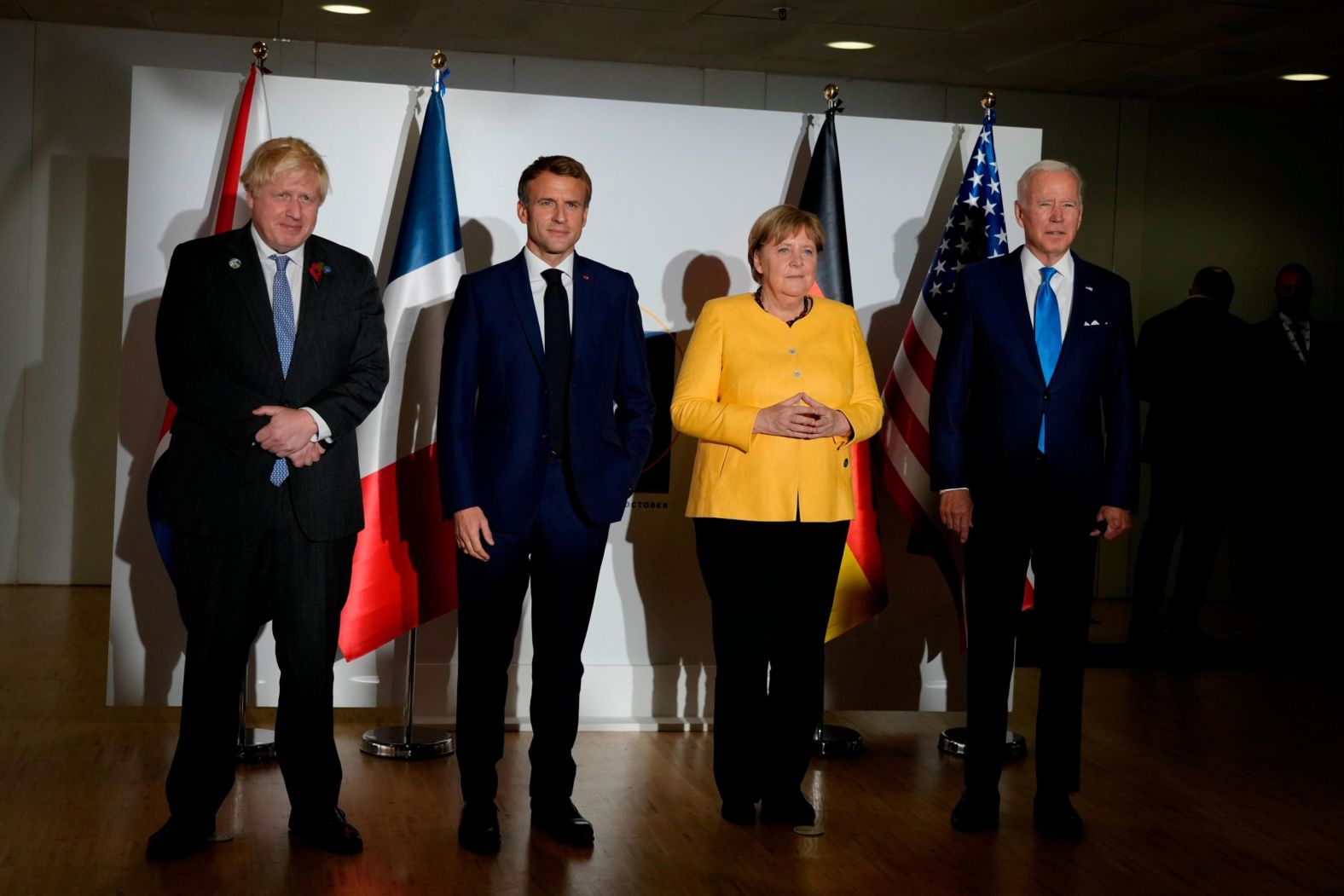 From left, Johnson, Macron, German Chancellor Angela Merkel and Biden pose for photos before a meeting on Saturday. They were meeting to <a href="index.php?page=&url=https%3A%2F%2Fwww.cnn.com%2Fworld%2Flive-news%2Fg20-rome-saturday-session%2Fh_d69b26aeed87aa61ecc0fa98508ccaf6" target="_blank">discuss next steps in negotiations with Iran.</a>