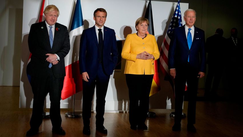 British Prime Minister Boris Johnson, French President Emmanuel Macron, German Chancellor Angela Merkel, and U.S. President Joe Biden, from left, pose for the media prior to a meeting at the La Nuvola conference center for the G20 summit in Rome, Saturday, Oct. 30.