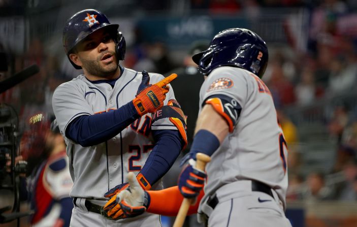 Jose Altuve of the Astros is congratulated by teammate Alex Bregman after <a href="index.php?page=&url=https%3A%2F%2Fwww.cnn.com%2Fsport%2Flive-news%2Fworld-series-2021-braves-astros-game-4%2Fh_c4c17c1fa246f22498c3a7c7d3cf0dd0" target="_blank">hitting a solo home run</a> during the fourth inning.