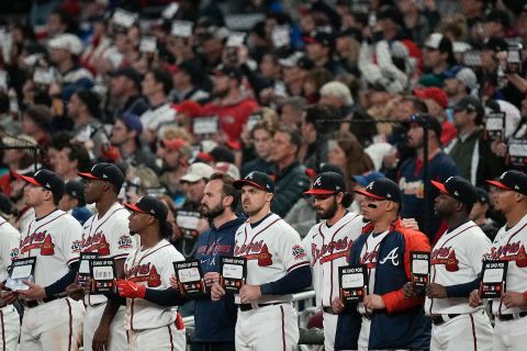 Members of the Atlanta Braves participate in a Stand Up To Cancer campaign at the end of the fifth inning.