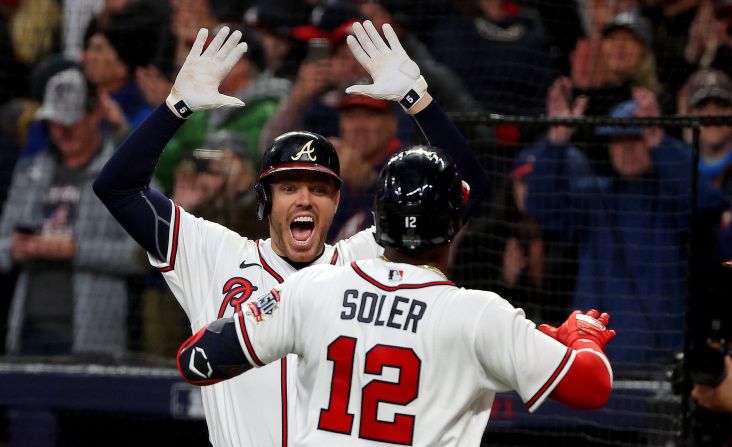 Braves pinch hitter Jorge Sole is congratulated by Freddie Freeman after <a href="index.php?page=&url=https%3A%2F%2Fwww.cnn.com%2Fsport%2Flive-news%2Fworld-series-2021-braves-astros-game-4%2Fh_4cc1f72398e49ba18e2c8084d3ab28c4" target="_blank">hitting a home run</a> to put Atlanta up 3-2. it came right after teammate Dansby Swanson hit a home run.