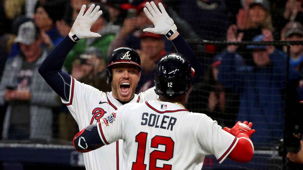 The Atlanta Braves' Jorge Soler is congratulated by Freddie Freeman after hitting a solo home run against the Houston Astros in Game 4. 