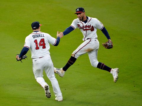 Adam Duvall and Eddie Rosario of the Atlanta Braves celebrate in the eighth inning after Rosario <a href="https://www.cnn.com/sport/live-news/world-series-2021-braves-astros-game-4/h_8e83ad53c8de208644674fa5db190371" target="_blank">caught a fly ball</a> hit by the Astros' Jose Altuve.