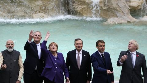G20 leaders perform the traditional coin toss in front of the Trevi Fountain at the G20 summit in Rome on Sunday.