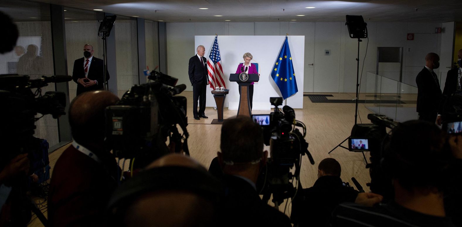 President Biden listens while European Commission President Ursula von der Leyen addresses the press at the G20 summit on Sunday.