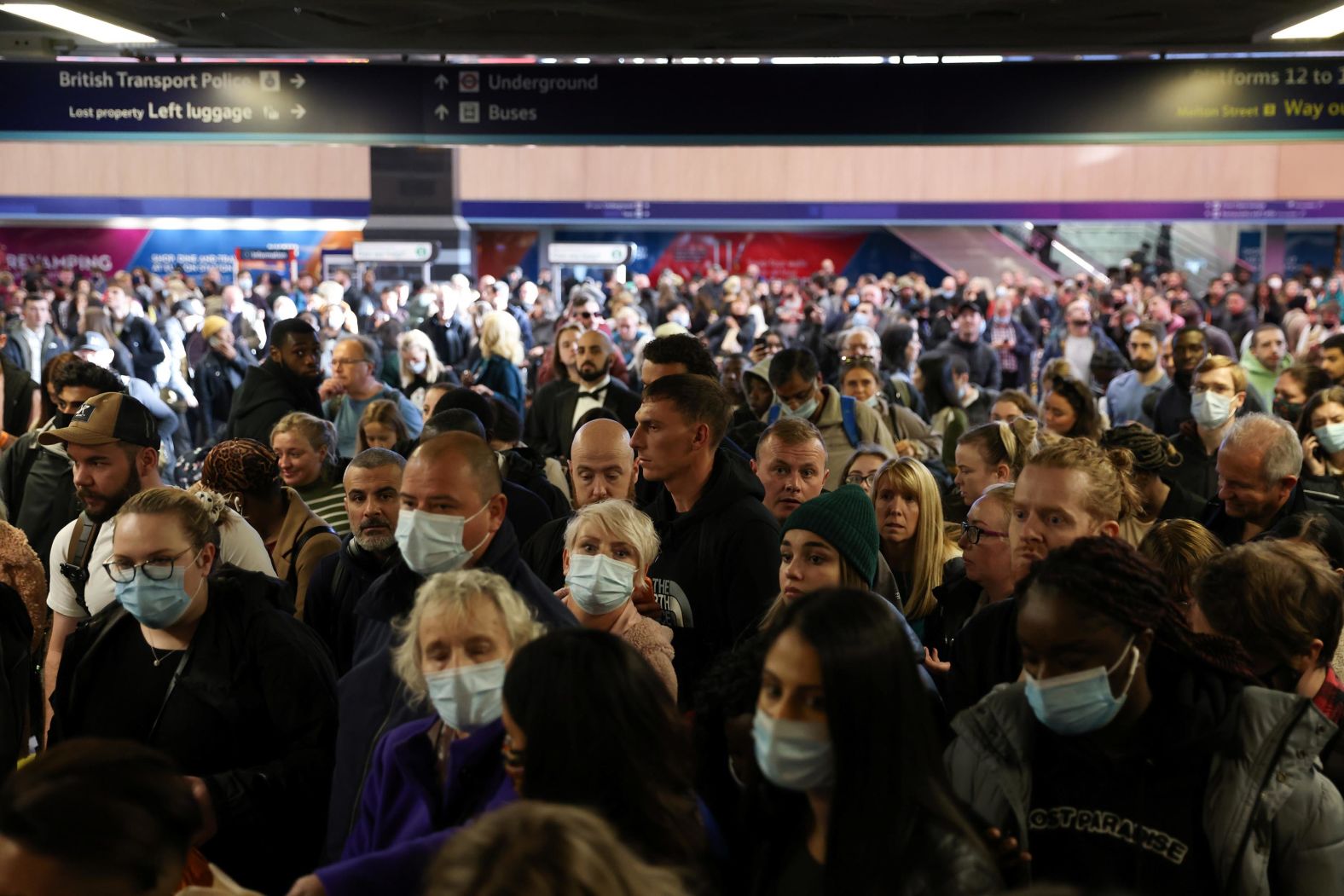 Passengers wait at Euston Station in London after trains were canceled Sunday ahead of the COP26 climate summit.